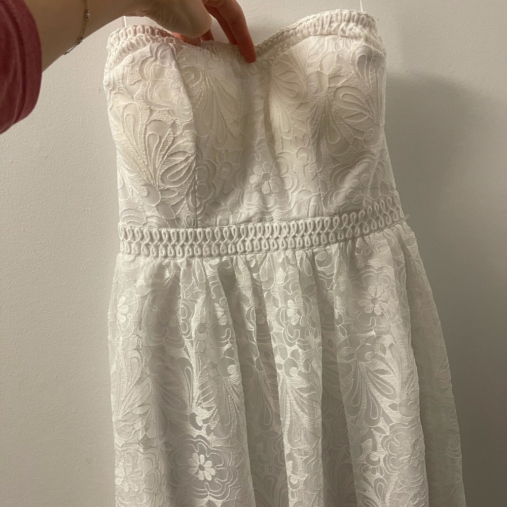 Midi white dress with beautiful details